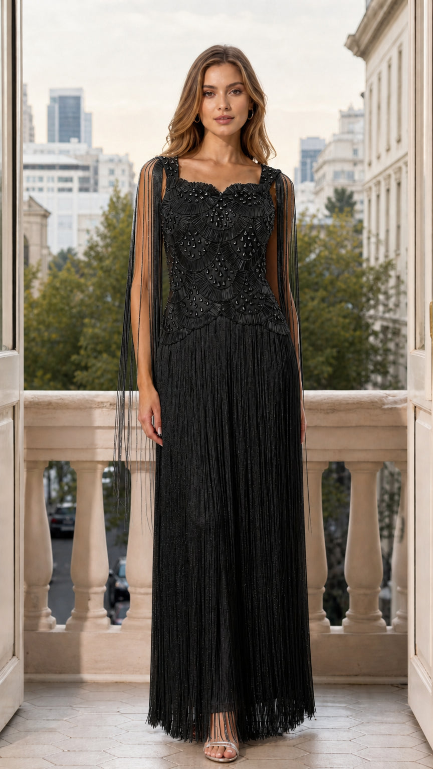 Front view of woman wearing black beaded fringe maxi evening gown