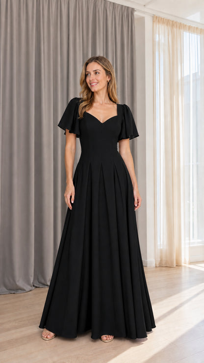 Front view of model wearing black formal maxi dress