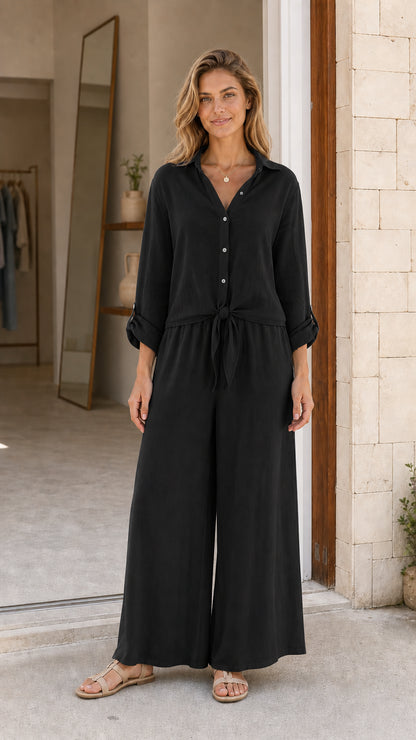 Front view of black button-down wide leg jumpsuit