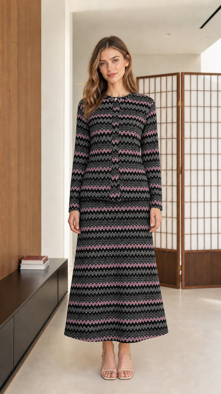 Front view of model wearing black and charcoal chevron knit two-piece maxi set