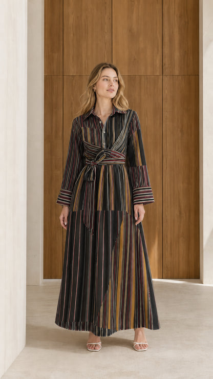Front view of model wearing black and dark multi striped long sleeve maxi shirt dress
