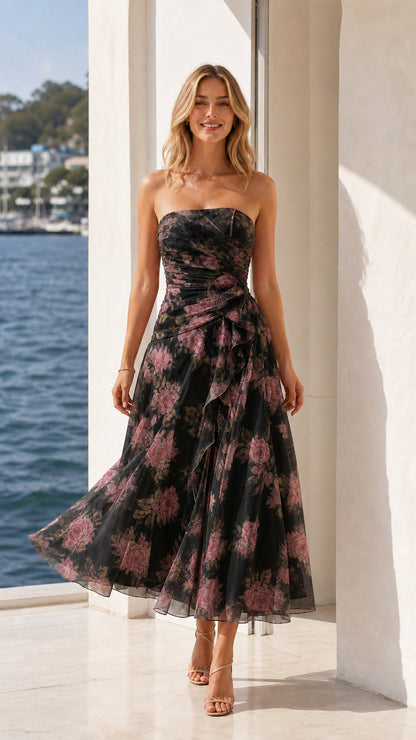 Model wearing black floral strapless midi dress