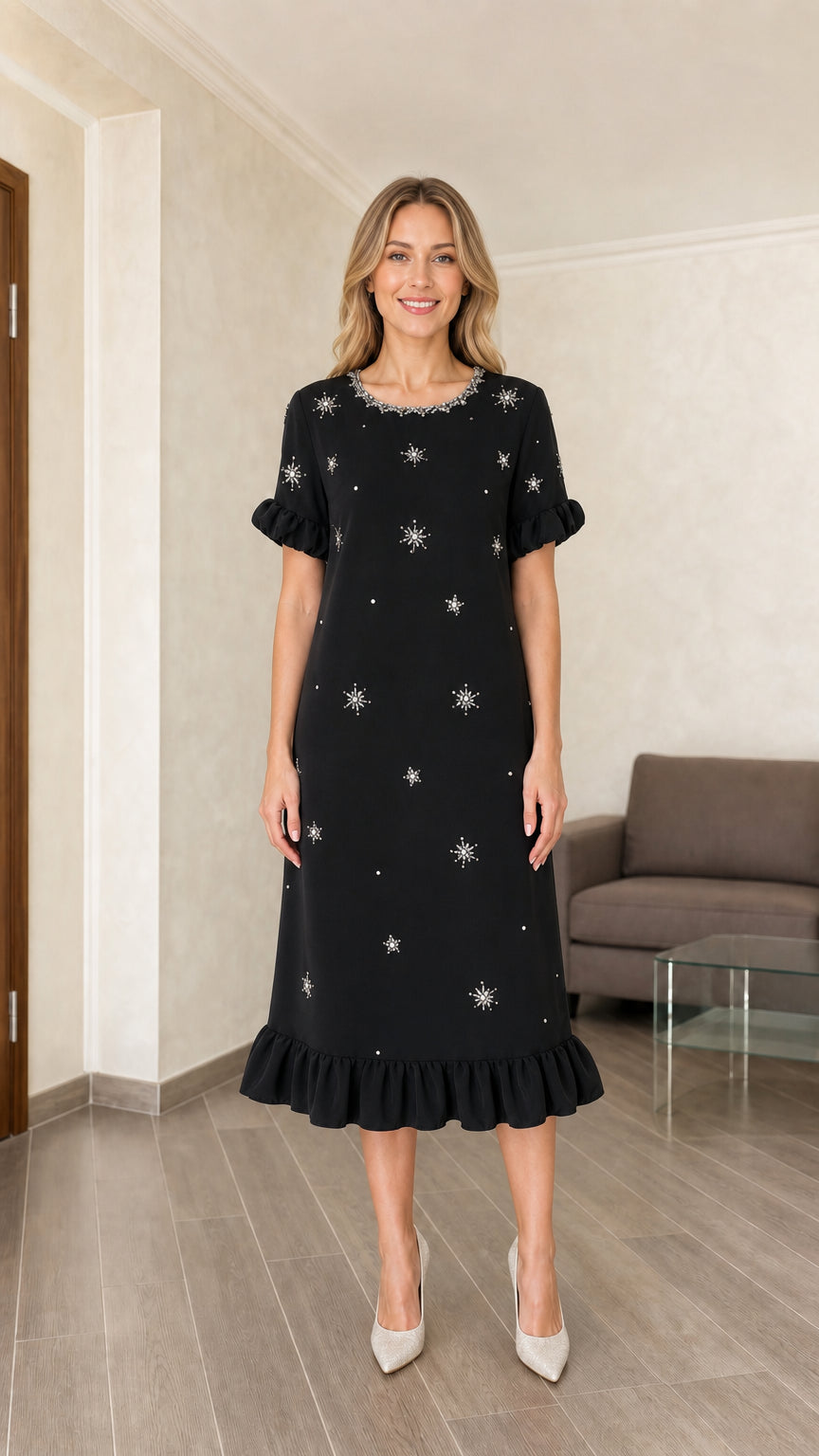 Model wearing black embellished midi dress