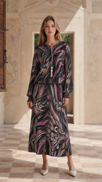 Model wearing black abstract print maxi dress set