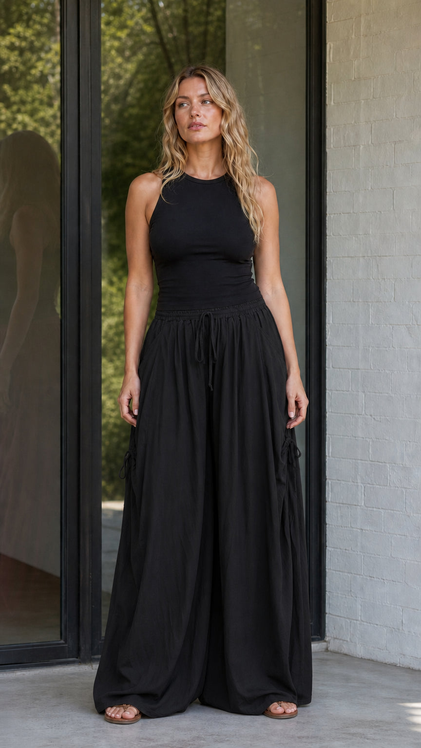 Front view of black wide-leg drawstring pants
