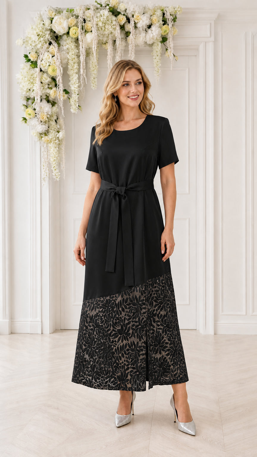 Model wearing black lace-trimmed midi dress