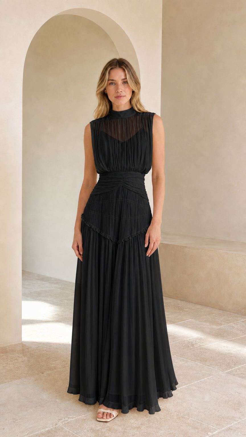 Model wearing black high-neck pleated chiffon sleeveless evening maxi dress