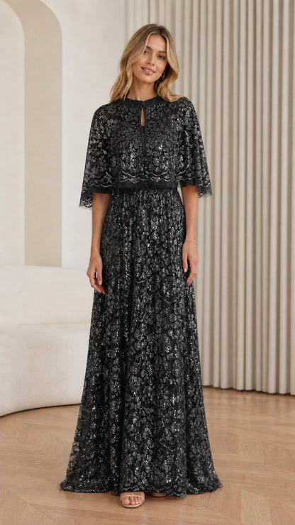 Front view of Black sequin cape maxi dress on model