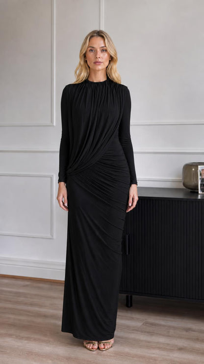Model wearing black ruched long-sleeve maxi dress