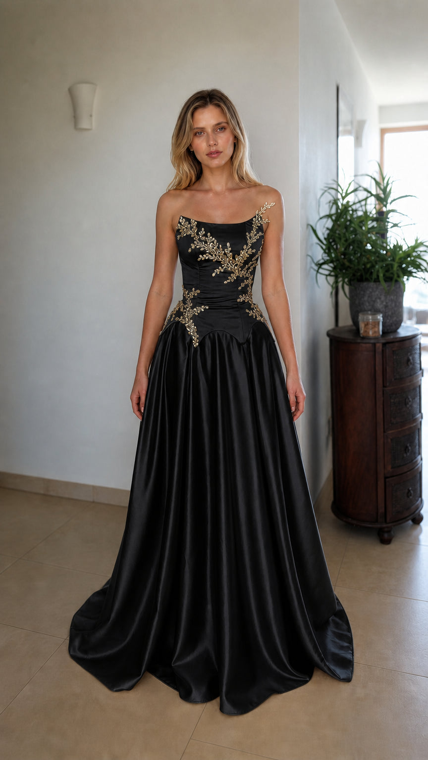 Front view of black strapless beaded corset evening dress
