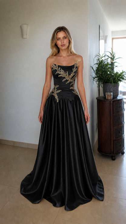 Front view of black strapless beaded corset evening dress