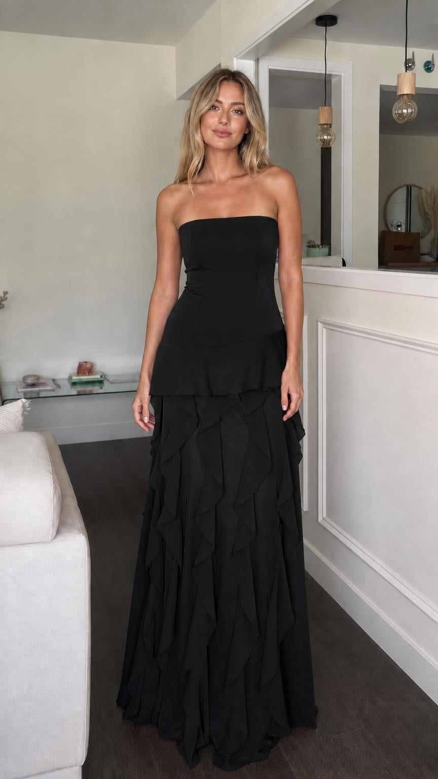 Front view of black strapless ruffle tiered maxi dress