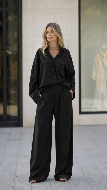 Full-length view of woman in black matching set