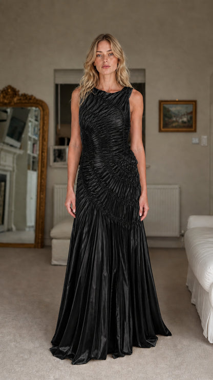 Front view of model wearing black ruched maxi dress