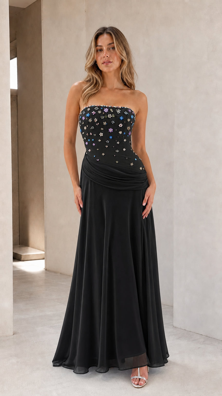 Full-length view of black strapless floral beaded chiffon formal gown