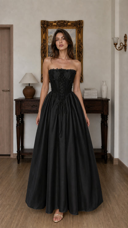 Front view of black corset ball gown maxi dress