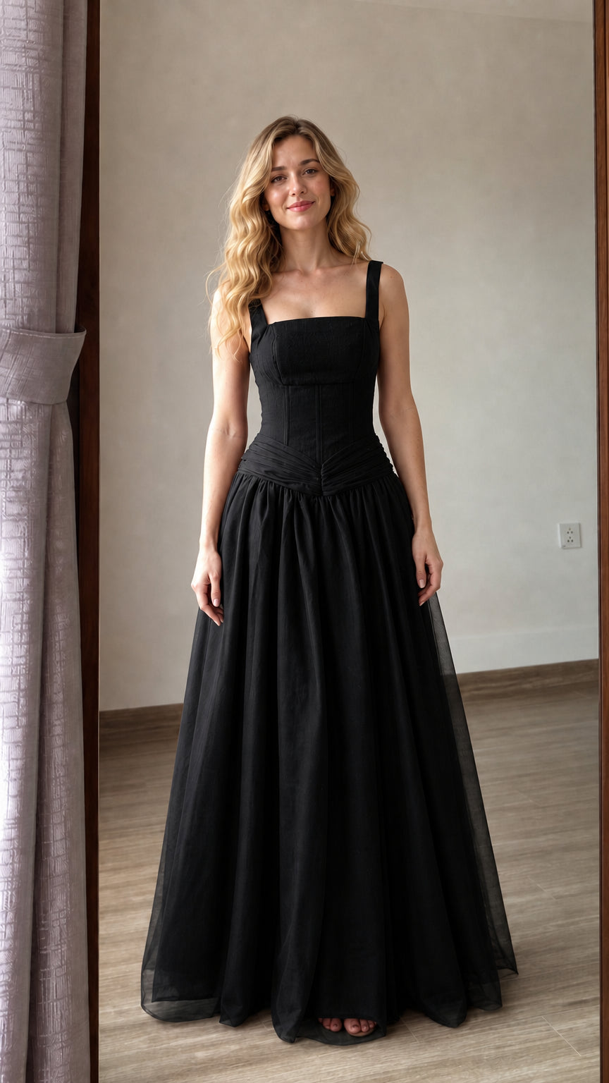 Front view of black corset-style long tulle evening gown