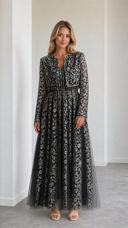 Model wearing black floral lace maxi dress with matching cropped jacket