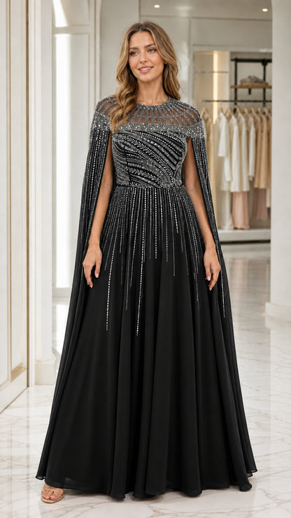 Front view of black evening gown with beaded capelet