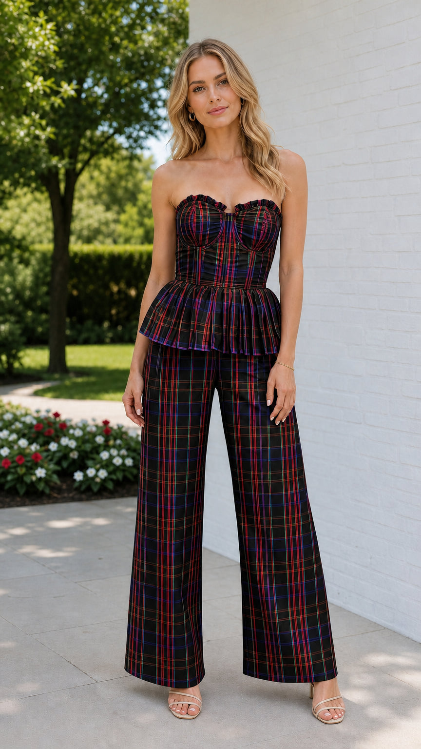 Model wearing black plaid strapless bustier and wide leg pants set