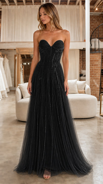 Front full view of model in the black strapless beaded tulle evening dress