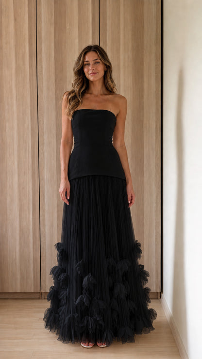 Woman wearing black strapless 3d floral tulle maxi dress
