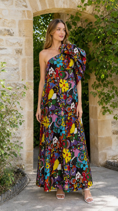 Model wearing black multi floral one-shoulder maxi dress