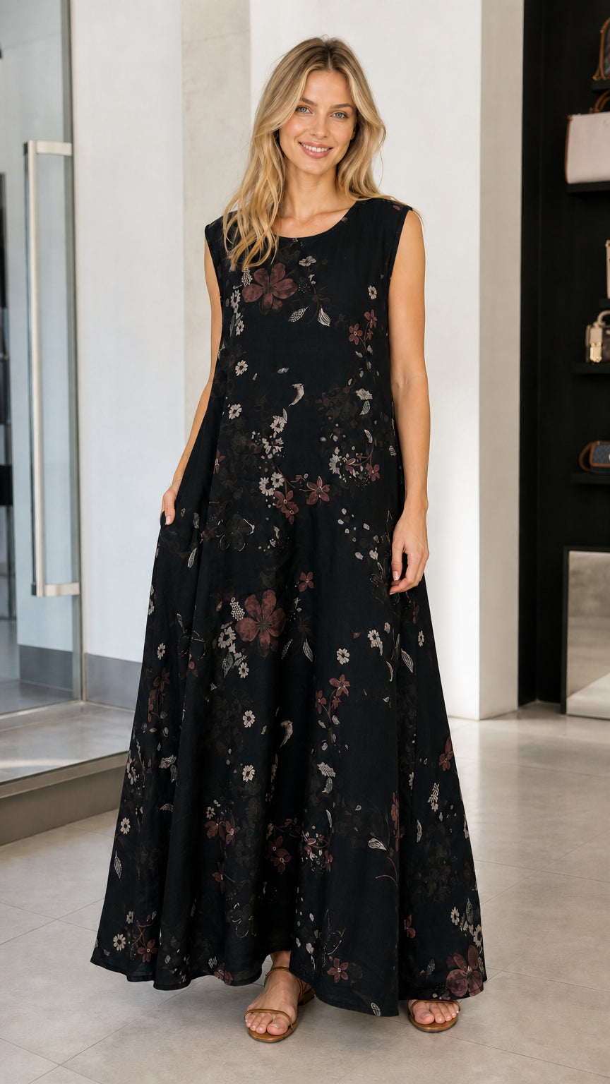 Model wearing black floral sleeveless maxi dress