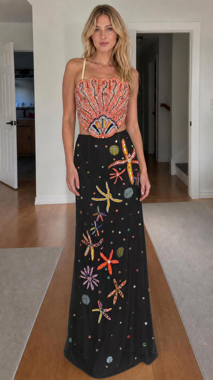 Model wearing black color variant of beaded seashell two-piece dress