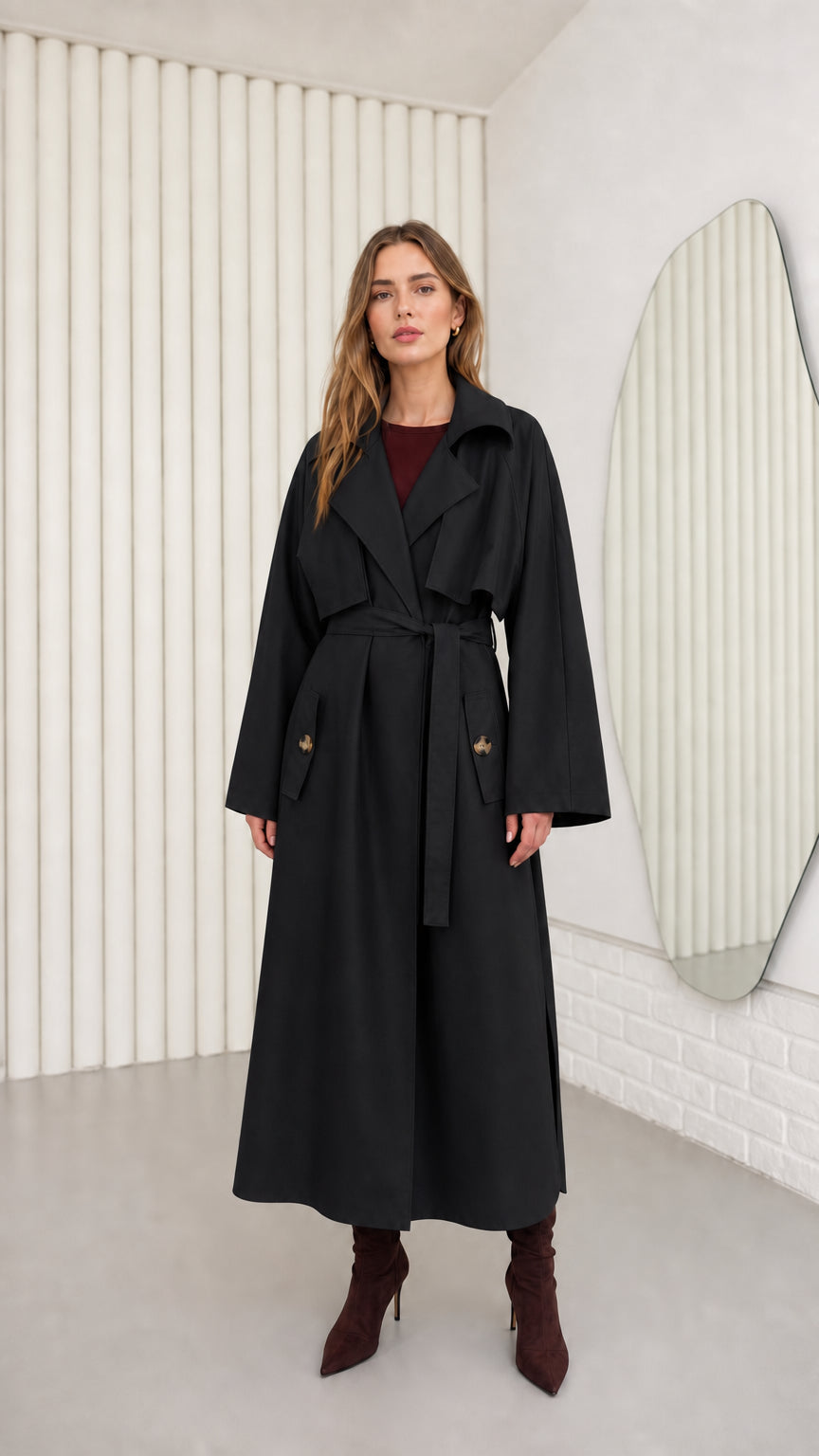 Model wearing Black oversized maxi belted trench coat