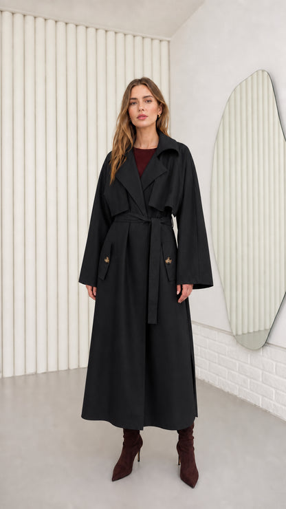 Model wearing Black oversized maxi belted trench coat