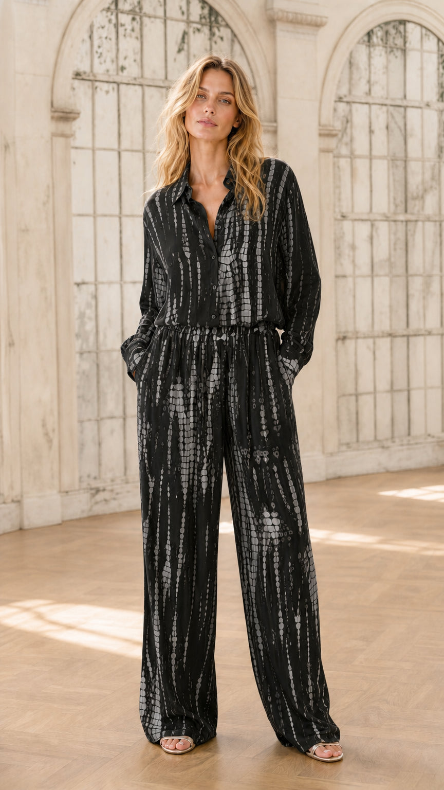 Model wearing black tie-dye jumpsuit