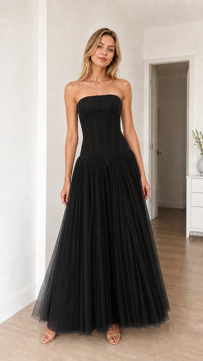 Model wearing black strapless corset tulle maxi dress