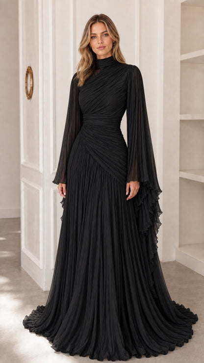 Model wearing classic black pleated high neck evening gown with cape sleeves