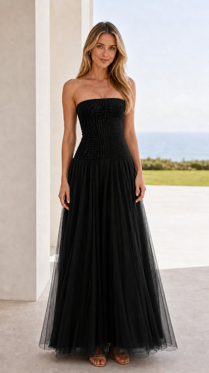 Front view of black strapless ruched tulle maxi dress