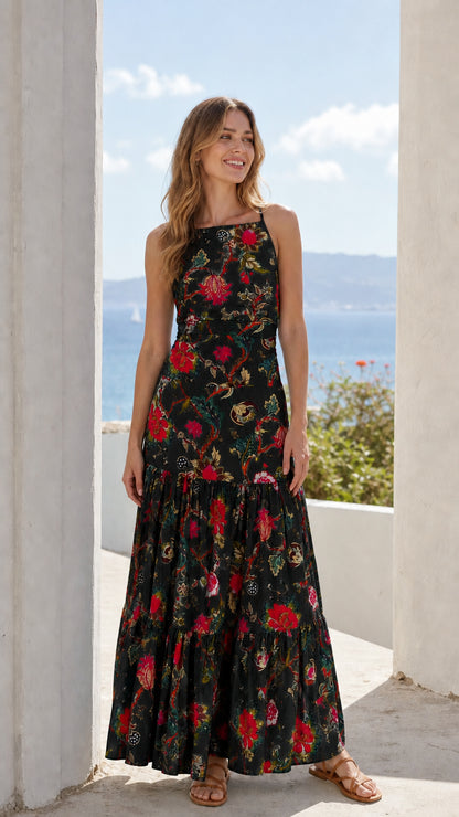 Woman wearing black floral tiered maxi dress