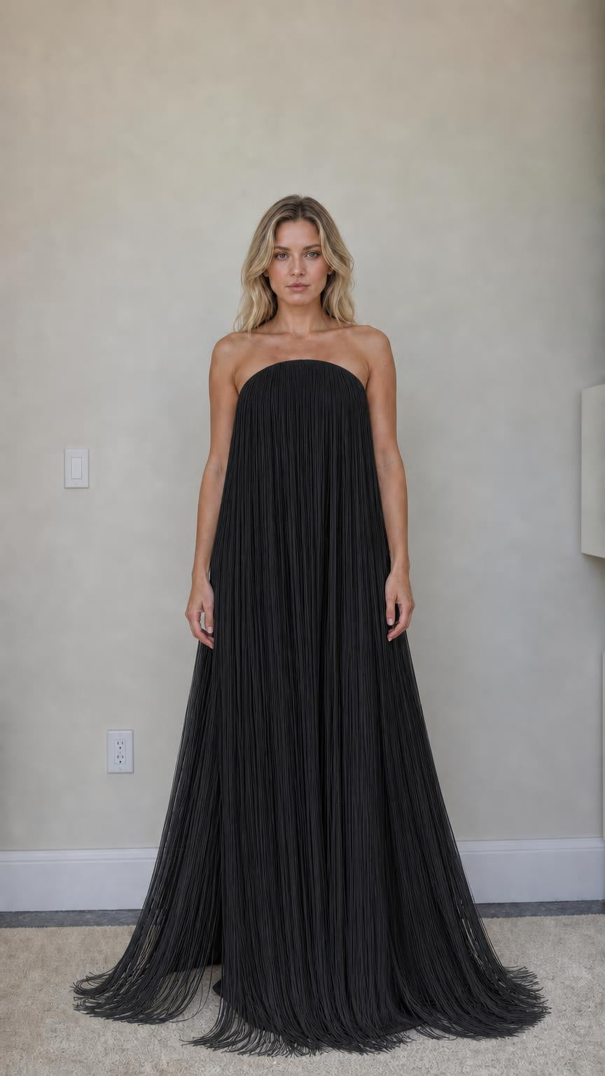 Front view of black strapless fringe maxi dress