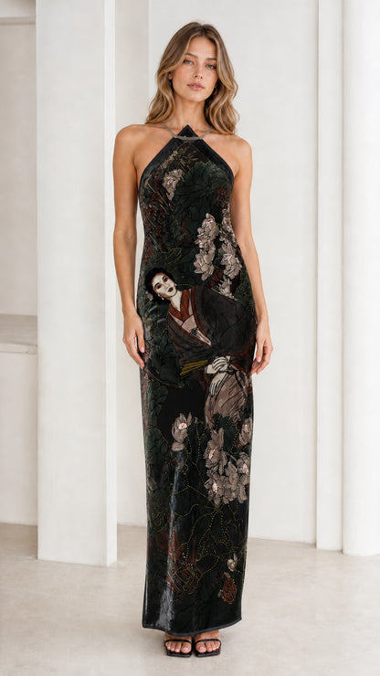 Model wearing black velvet halter maxi dress