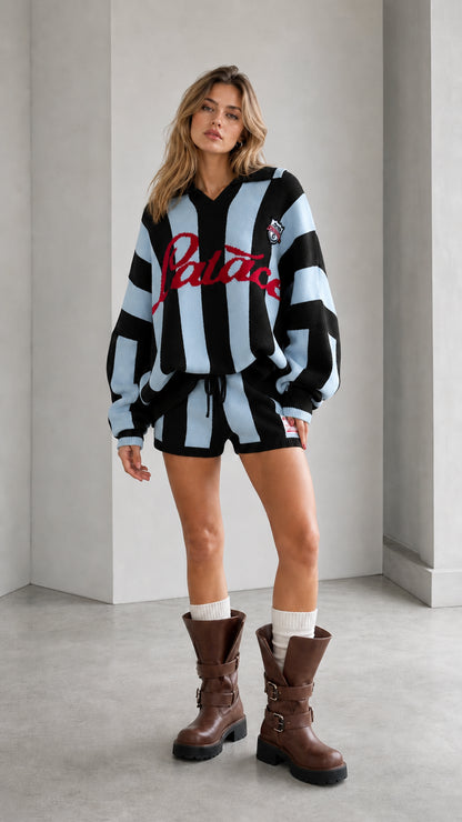 Model wearing black and light blue striped knit sweater and shorts two-piece set