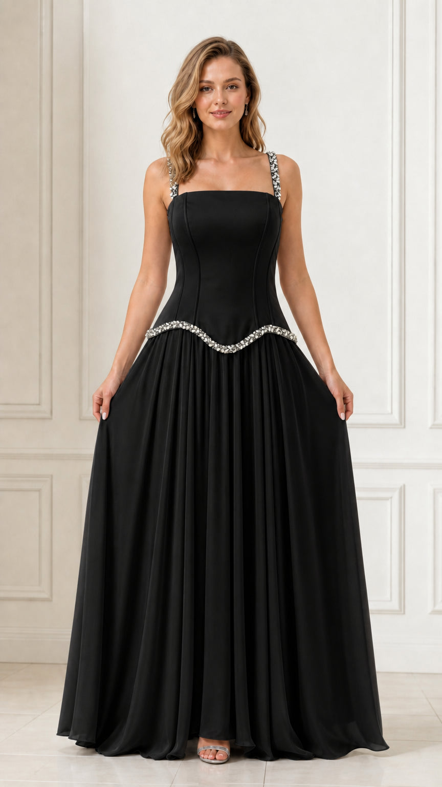 Full front view of a woman wearing a black crystal-embellished chiffon evening dress