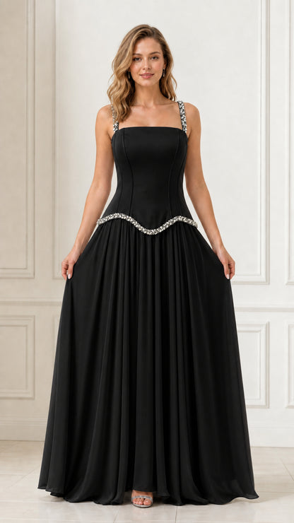 Full front view of a woman wearing a black crystal-embellished chiffon evening dress