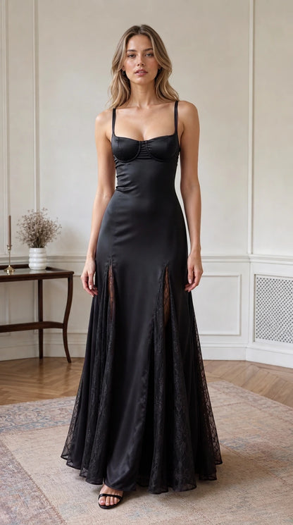Full-length front view of black satin bustier evening gown with lace panels