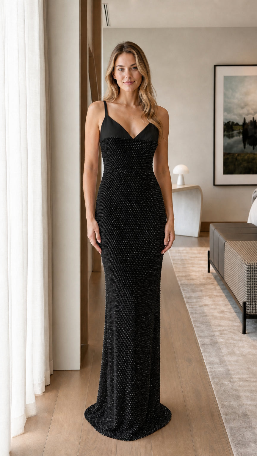 Model wearing black sequin maxi dress