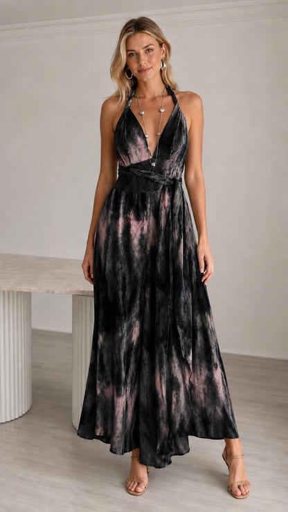 Model wearing black tie-dye halter neck maxi jumpsuit