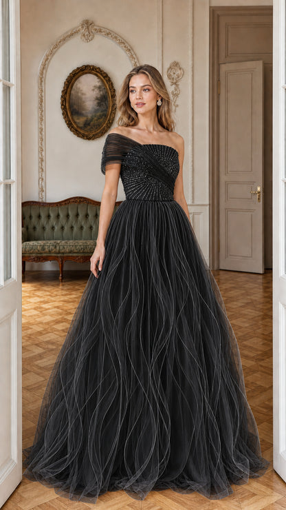 Front view of model wearing black sequined tulle formal ball gown