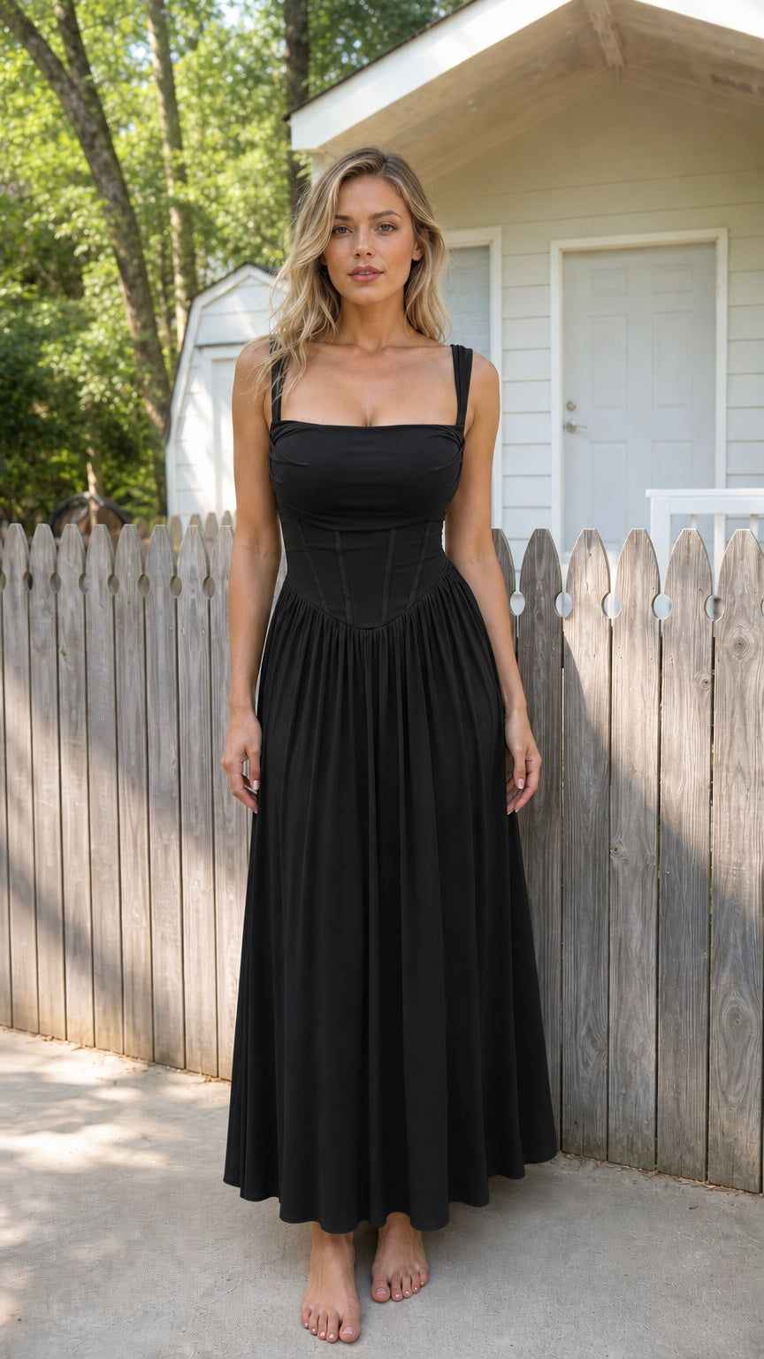 Front view of woman wearing black corset cami maxi dress