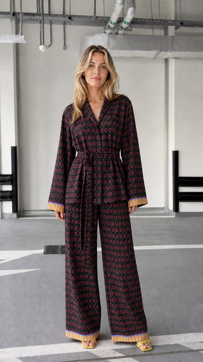 Woman wearing black patterned two-piece lounge set
