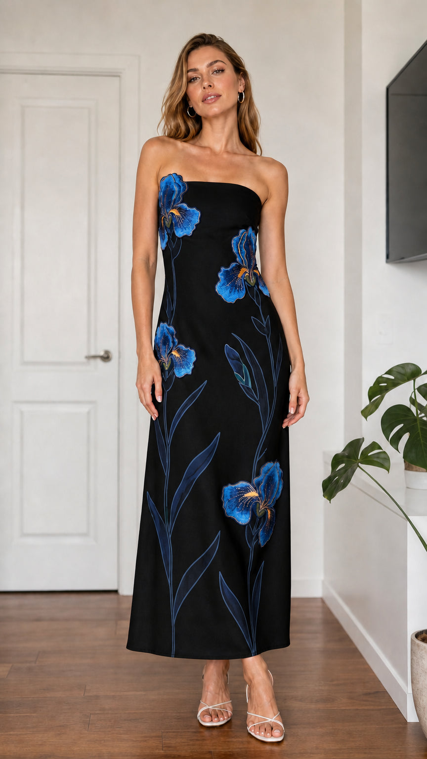 Model wearing black strapless floral embroidered maxi dress