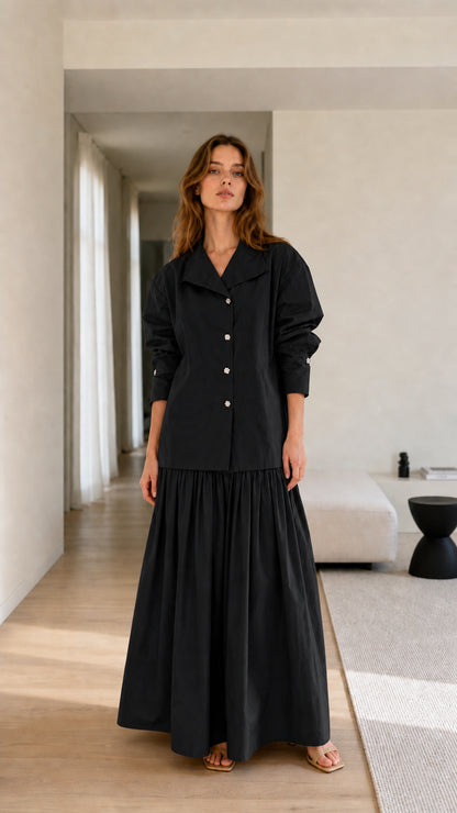 Model wearing black two-piece set