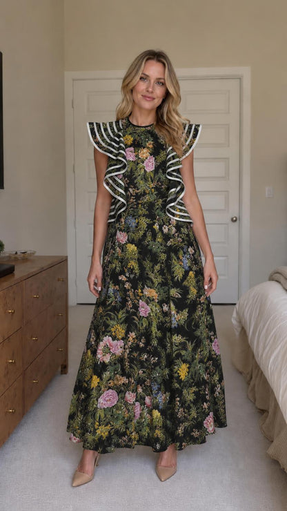 Woman wearing black floral ruffle maxi dress
